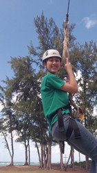 Sophie on the ropes course at camp