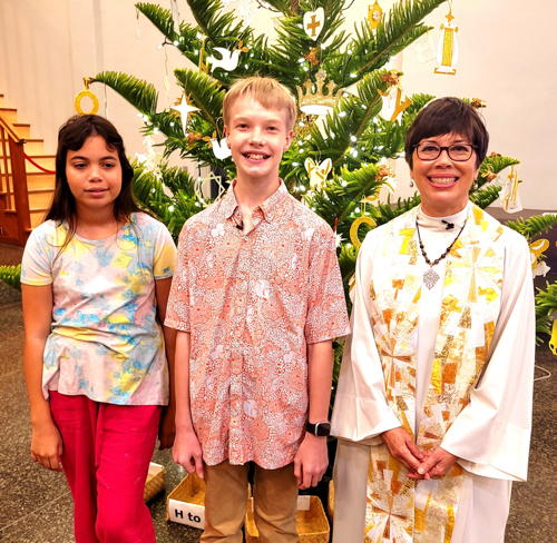 Pr. Margrethe with confirmands on Christmas Eve