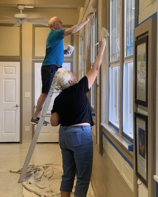 Painting the new windows installed in Isenberg Hall. You can see outside so clearly now!