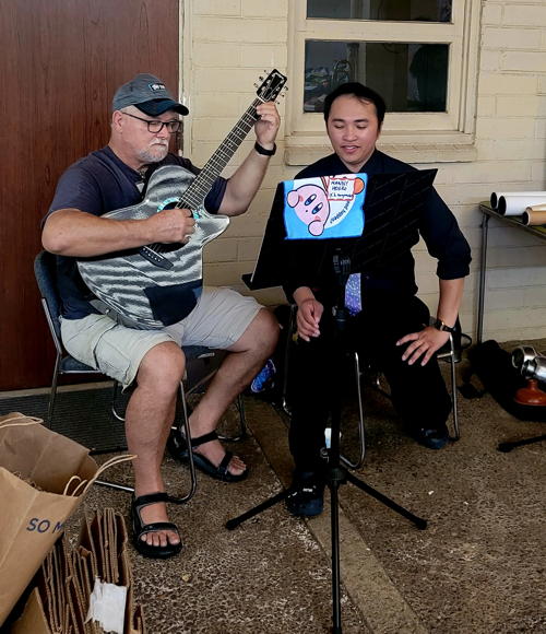 Pastor Jeff and Emmanuel Hobro provided music for the LCH community Free Store event.