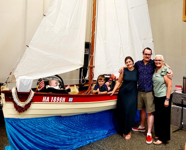 The Lilley family with the boat Jeff built