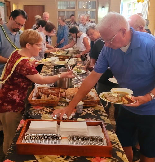 Members and friends prepare the plates for Lenten Suppers