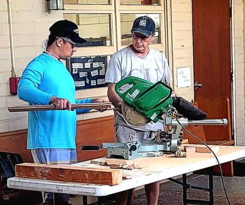 Teamwork in action! Keane Ishii and Rich Mundell join forces to prepare pieces for the new loft.