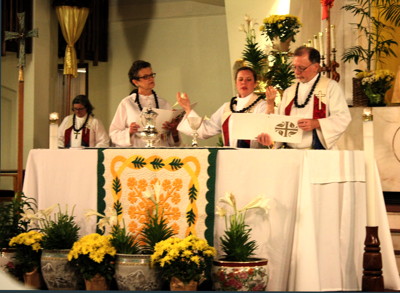 Pastor Angela Freeman celebrates communion at the opening worship for Synod assembly