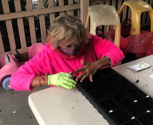 Peggy Anderson plants seeds