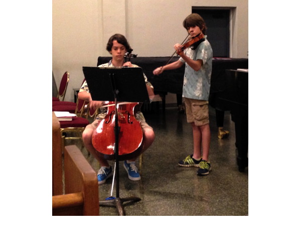 Two brothers play part of a sonata