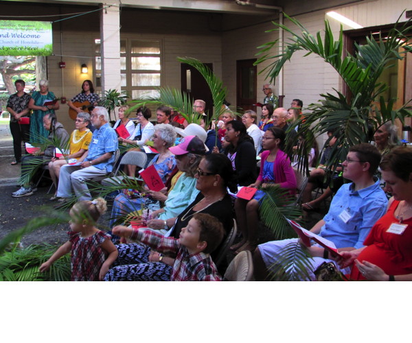 Both morning worship services on Palm Sunday begin in the courtyard.