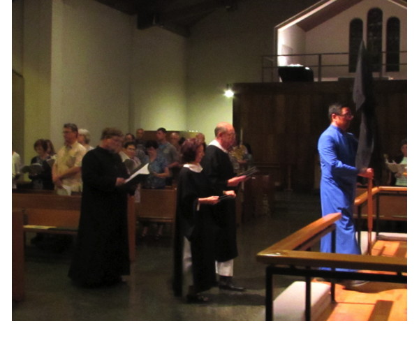 For the Good Friday portion of the Triduum, the cross is veiled, and ministers are dressed in black.