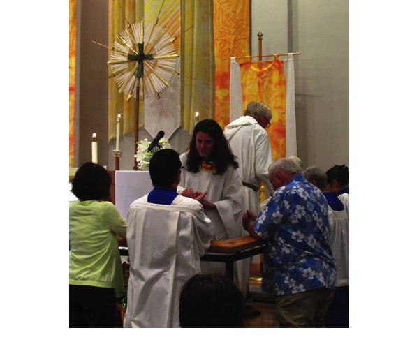 Receiving communion at the rail.